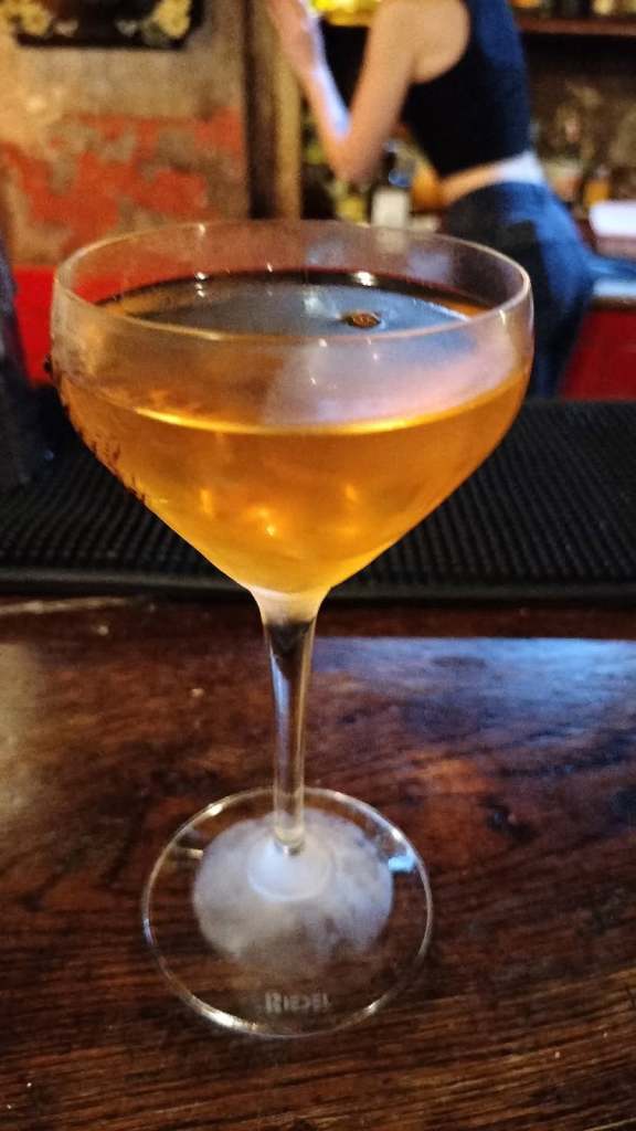 Cocktail with Mexican Abasolo whisky made at Cinco in London.